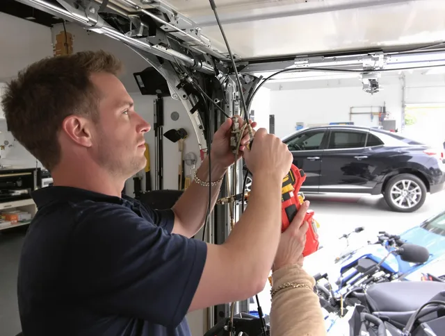 Glastonbury Garage Door Repair safety certified technician performing cable replacement in Glastonbury