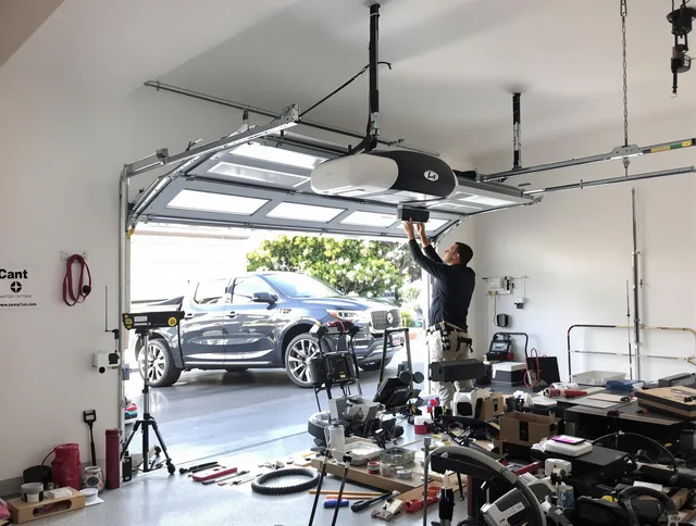 Glastonbury Garage Door Repair specialist installing smart garage door opener system in Glastonbury home